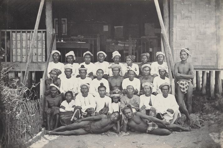 Portrait of a group of Burmese men on a porch c. 1868