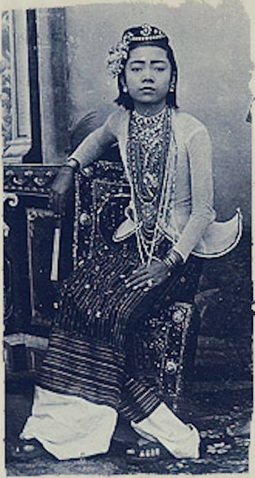 Portrait of a Burmese entertainer taken at the Johannes & Co. Studio on C Road in Mandalay c. 1895